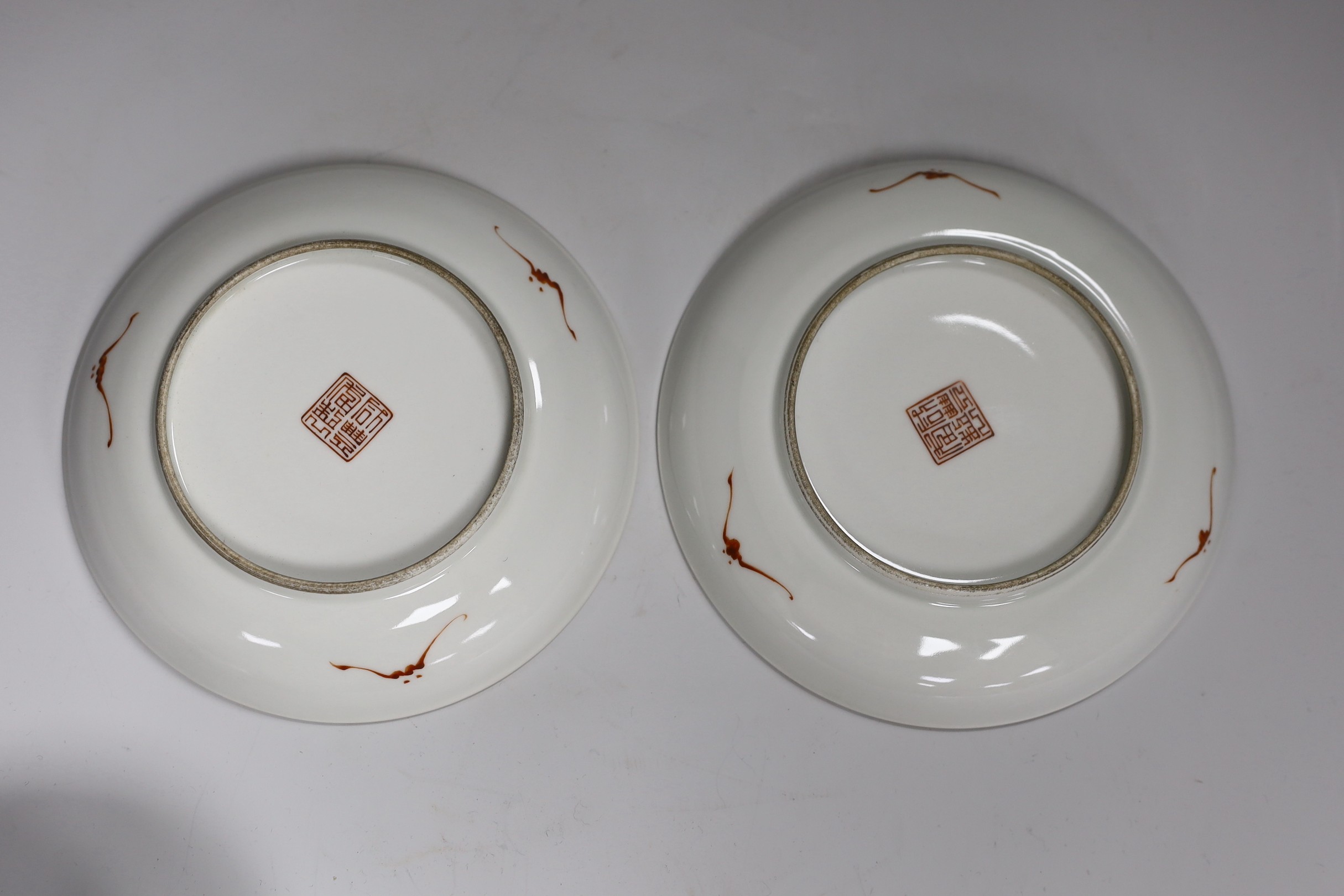 A pair of Chinese famille rose bowls and two similar saucer dishes